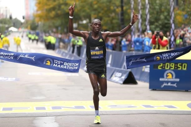 Benson Kipruto of Kenya reacts as he crosses the finish line to win the 125th Boston Marathon on October 11, 2021 in Boston, Massachusetts.