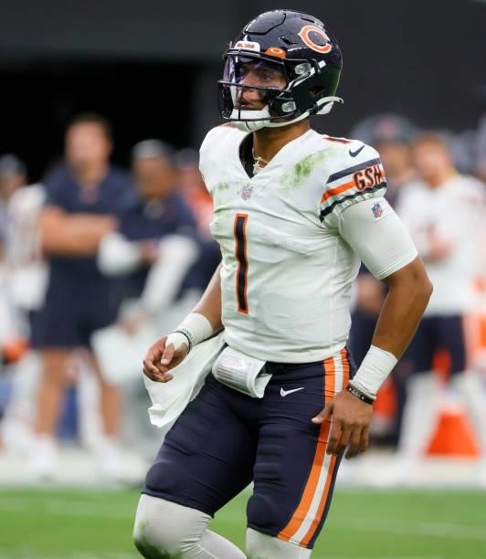 Quarterback Justin Fields of the Chicago Bears stands on the field during a timeout in a game against the Las Vegas Raiders at Allegiant Stadium on...