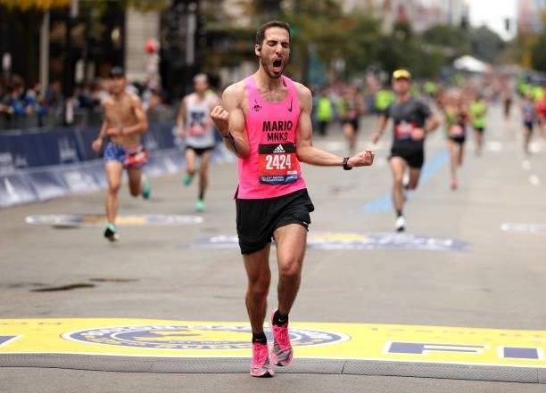 Mario Maruri reacts as he crosses the finish line during the 125th Boston Marathon on October 11, 2021 in Boston, Massachusetts.