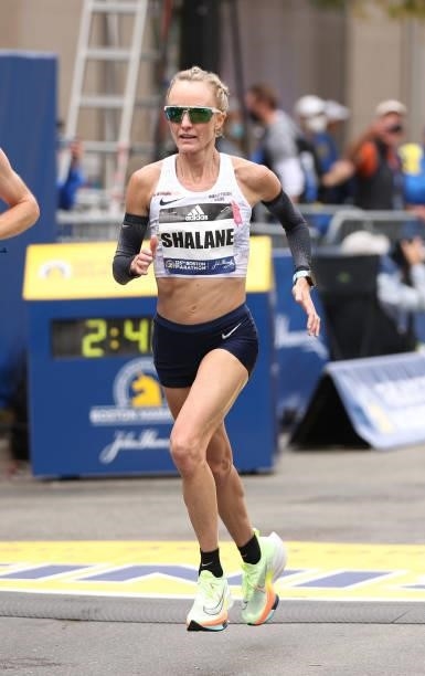 Shalane Flanagan of the United States crosses the finish line during the 125th Boston Marathon on October 11, 2021 in Boston, Massachusetts.