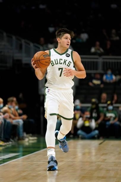 Grayson Allen of the Milwaukee Bucks dribbles the ball against the Oklahoma City Thunder in the first half during a preseason game at Fiserv Forum on...