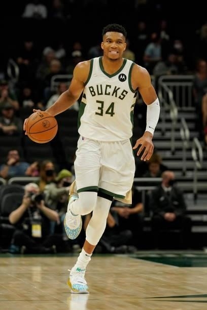 In the first half during a preseason game at Fiserv Forum on October 10, 2021 in Milwaukee, Wisconsin. NOTE TO USER: Giannis Antetokounmpo of the...