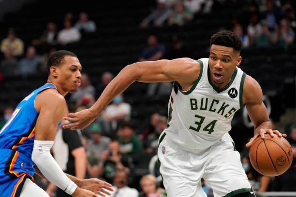 Giannis Antetokounmpo of the Milwaukee Bucks drives to the basket against Darius Bazley of the Oklahoma City Thunder in the first half during a...