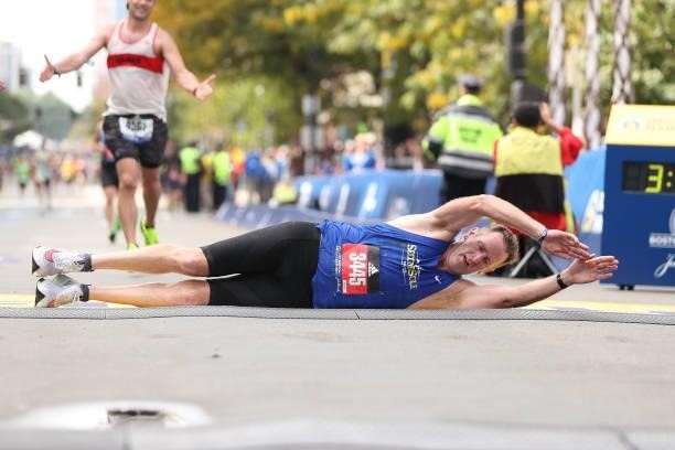 Michael Porter crosses the finish line during the 125th Boston Marathon on October 11, 2021 in Boston, Massachusetts.