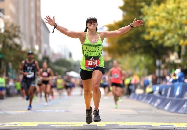 Dana Bogan crosses the finish line during the 125th Boston Marathon on October 11, 2021 in Boston, Massachusetts.