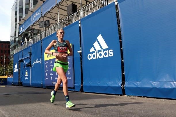 Tiffany McBroom crosses the finish line during the 125th Boston Marathon on October 11, 2021 in Boston, Massachusetts.