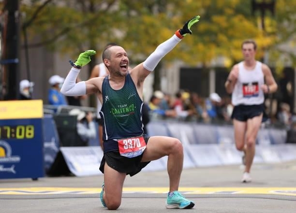 Jose Luis Cruz Martinez reacts as he crosses the finish line during the 125th Boston Marathon on October 11, 2021 in Boston, Massachusetts.