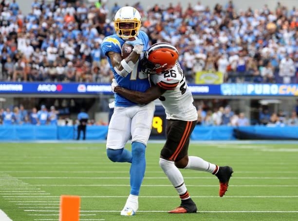 Keenan Allen of the Los Angeles Chargers is tackled by Greedy Williams of the Cleveland Browns after his catch during a 47-42 win over the Cleveland...
