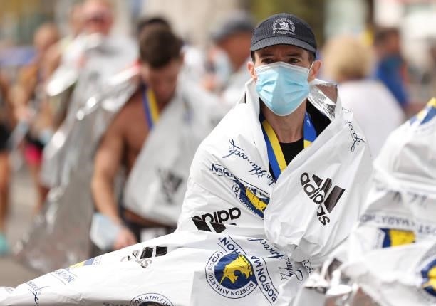 Runner receives a blanker after finishing the 125th Boston Marathon on October 11, 2021 in Boston, Massachusetts.