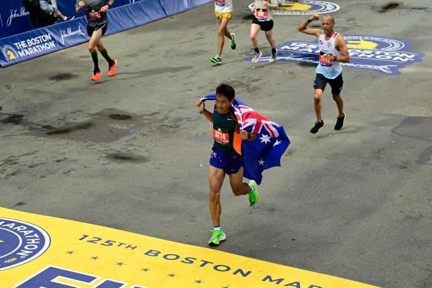 Runners near the finish line on Boylston Street during the 125th Boston Marathon on October 11, 2021 in Boston, Massachusetts.