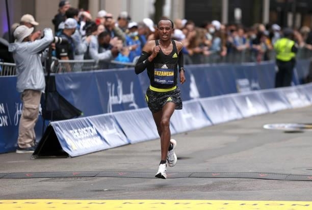 Kelkile Gezahegn of Ethiopia crosses the finish line during the 125th Boston Marathon on October 11, 2021 in Boston, Massachusetts.
