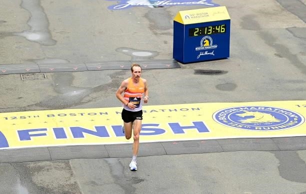 Scott Fauble of the United States crosses the finish line during the 125th Boston Marathon on October 11, 2021 in Boston, Massachusetts.