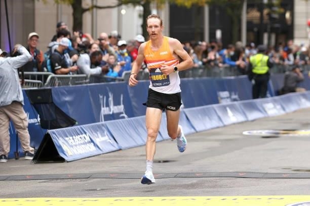 Scott Fauble of the United States crosses the finish line during the 125th Boston Marathon on October 11, 2021 in Boston, Massachusetts.
