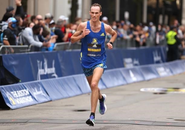 Matthew McDonald of the United States crosses the finish line during the 125th Boston Marathon on October 11, 2021 in Boston, Massachusetts.