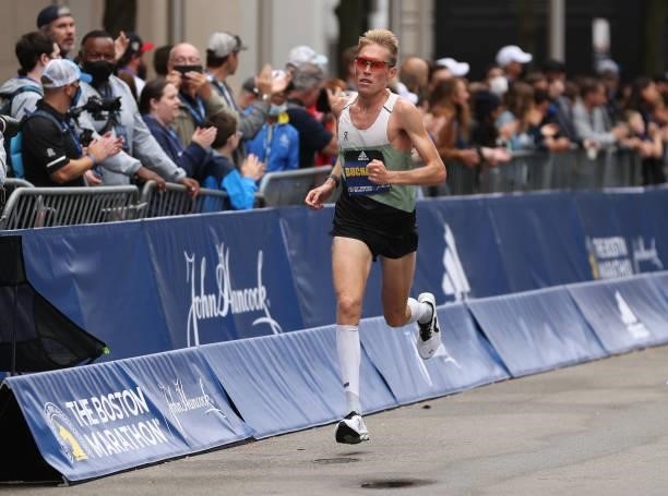 Reid Buchanan of the United States crosses the finish line during the 125th Boston Marathon on October 11, 2021 in Boston, Massachusetts.