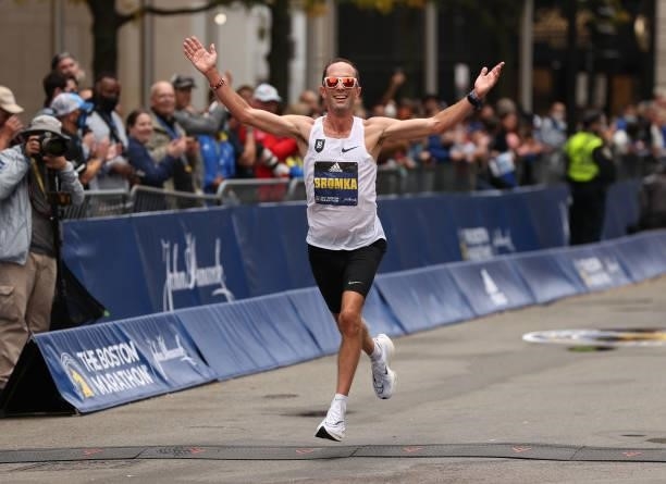 Peter Bromka of the United States crosses the finish line during the 125th Boston Marathon on October 11, 2021 in Boston, Massachusetts.