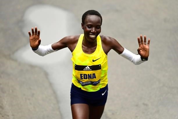 Edna Kiplagat of Kenya crosses the finish line for second place during the 125th Boston Marathon on October 11, 2021 in Boston, Massachusetts.