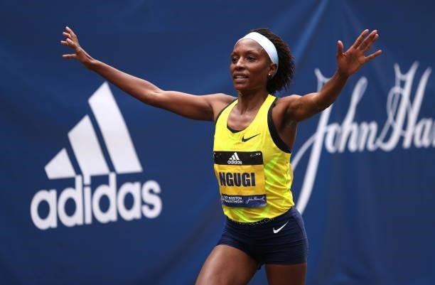 Mary Ngugi of Kenya crosses the finish line for second place during the 125th Boston Marathon on October 11, 2021 in Boston, Massachusetts.
