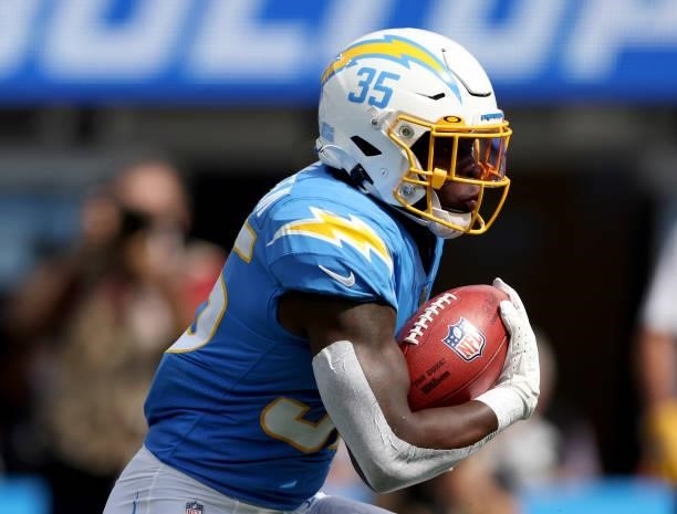 Larry Rountree III of the Los Angeles Chargers carries the ball during a 47-42 win over the Cleveland Browns at SoFi Stadium on October 10, 2021 in...