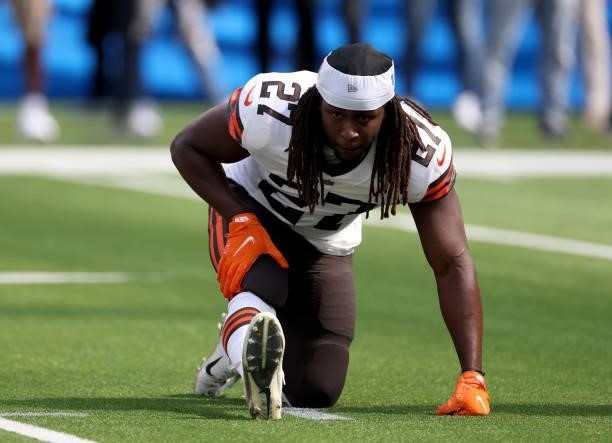 Kareem Hunt of the Cleveland Browns stretches during warm up before the game against the Los Angeles Chargers at SoFi Stadium on October 10, 2021 in...