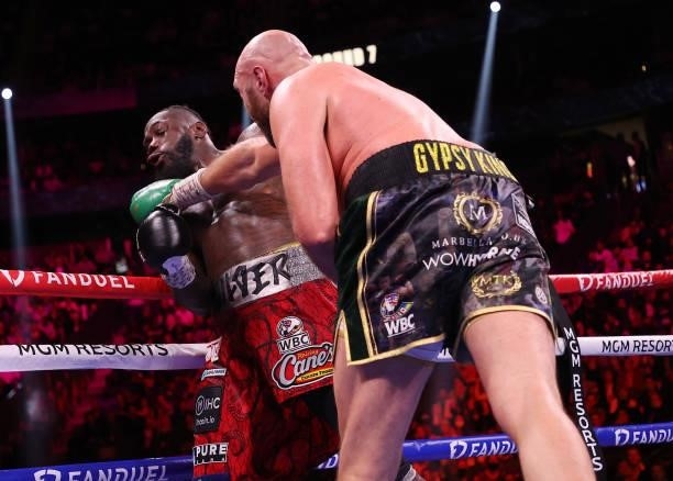 Tyson Fury punches Deontay Wilder during their WBC heavyweight championship at T-Mobile Arena on October 09, 2021 in Las Vegas, Nevada.