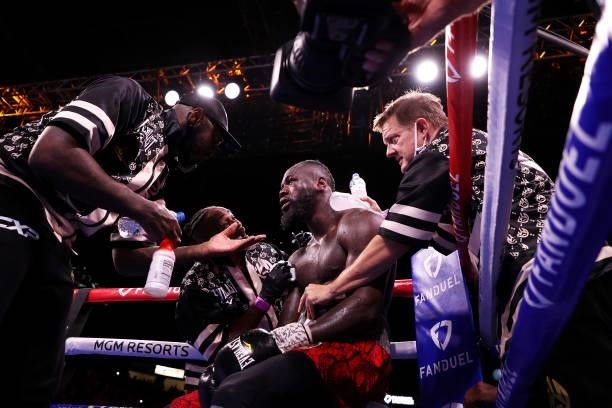 Deontay Wilder is tended to in his corner between rounds against Tyson Fury during their WBC heavyweight championship at T-Mobile Arena on October...