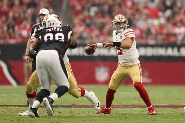 Quarterback Trey Lance of the San Francisco 49ers throws a pass during the NFL game at State Farm Stadium on October 10, 2021 in Glendale, Arizona....