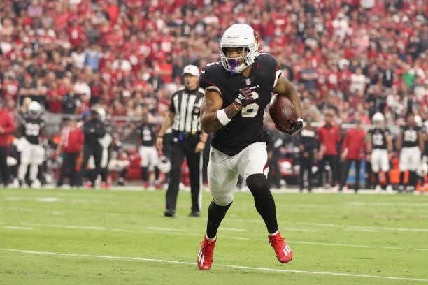 Running back James Conner of the Arizona Cardinals rushes the football against the San Francisco 49ers during the NFL game at State Farm Stadium on...