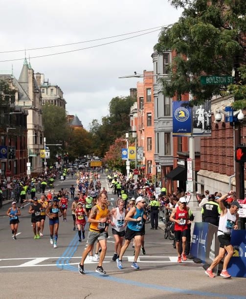 Runners turn onto Boylston street during the 125th Boston Marathon on October 11, 2021 in Boston, Massachusetts.