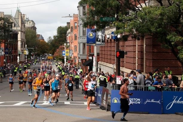 Runners turn onto Boylston street during the 125th Boston Marathon on October 11, 2021 in Boston, Massachusetts.