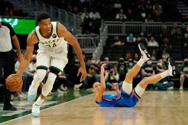 Giannis Antetokounmpo of the Milwaukee Bucks steals the ball from Aleksej Pokusevski of the Oklahoma City Thunder in the first half during a...