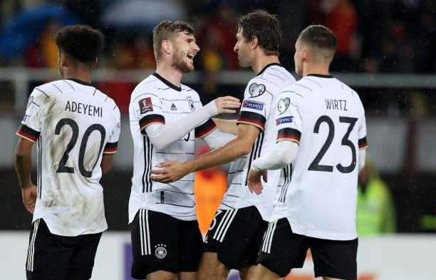 Timo Werner of Germany celebrates with Thomas Muller after scoring their team's second goal during the 2022 FIFA World Cup Qualifier match between...