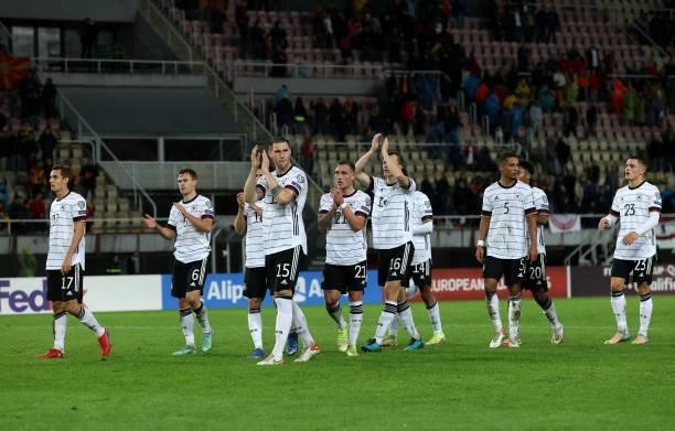 Niklas Sule of Germany leads his teammates as they applaud the fans after the 2022 FIFA World Cup Qualifier match between North Macedonia and Germany...