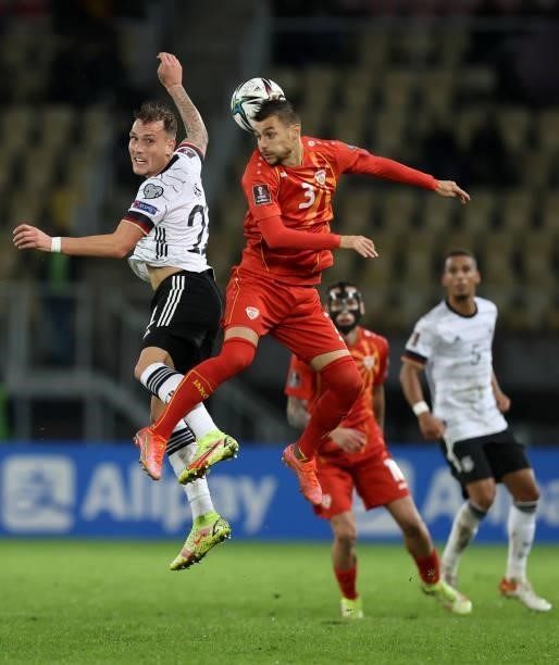 David Raum of Germany and Stefan Askovski of North Macedonia battle for the ball during the 2022 FIFA World Cup Qualifier match between North...