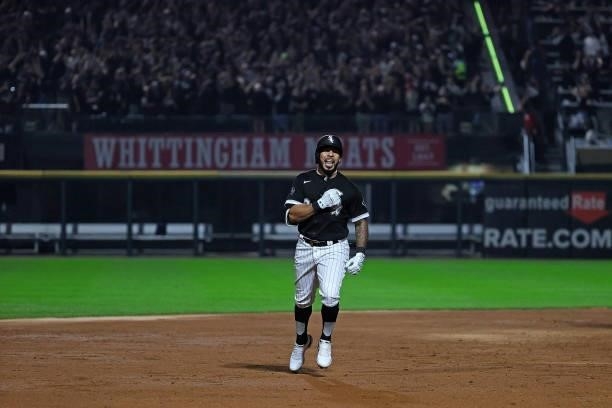 Leury Garcia of the Chicago White Sox celebrates a home run during game three of the American League Division Series against the Houston Astros at...