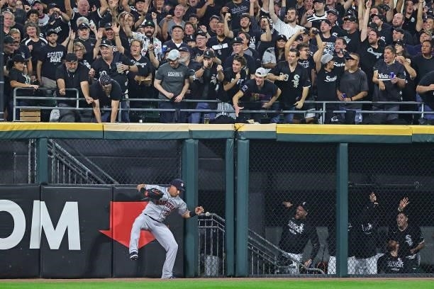 Michael Brantley of the Houston Astros is unable to catch a home run ball during game three of the American League Division Series against the...