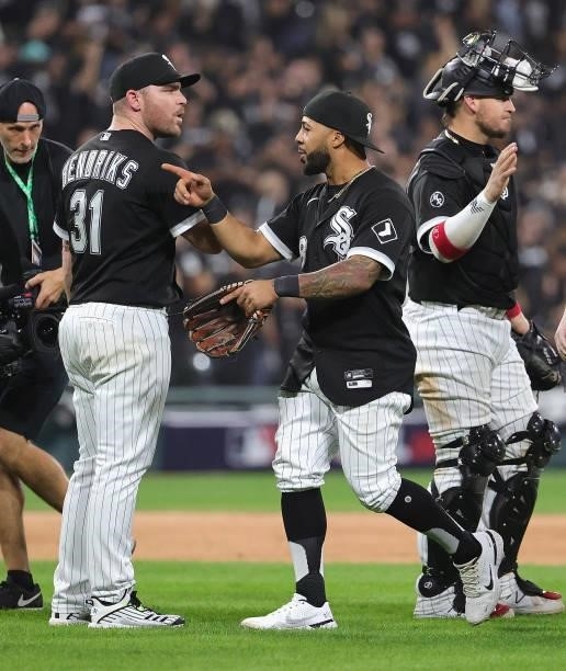 Liam Hendriks, Leury Garcia and Yasmani Grandal of the Chicago White Sox celebrate a win over the Houston Astros at Guaranteed Rate Field on October...