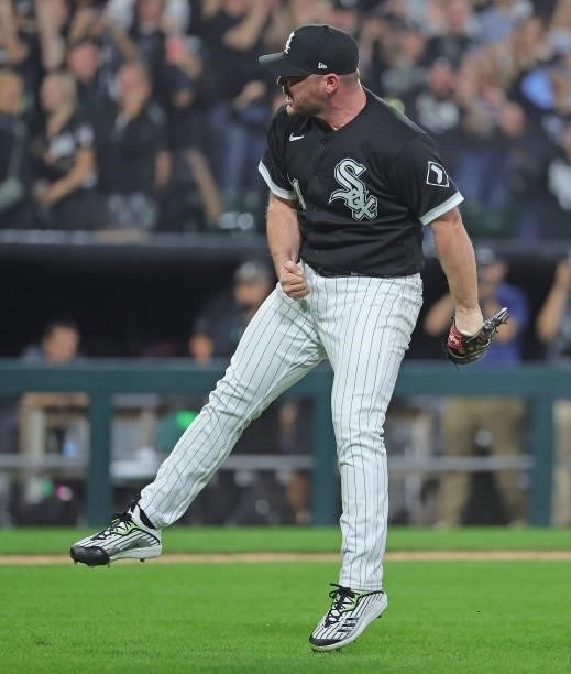 Liam Hendriks of the Chicago White Sox celebrates a win over the Houston Astros at Guaranteed Rate Field on October 10, 2021 in Chicago, Illinois....