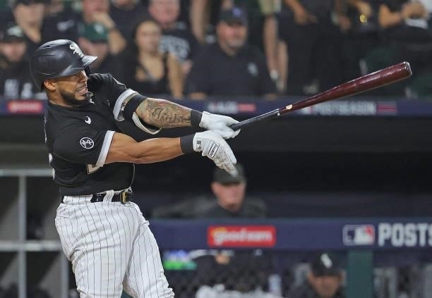 Leury Garcia of the Chicago White Sox hits a double against the Houston Astros at Guaranteed Rate Field on October 10, 2021 in Chicago, Illinois. The...