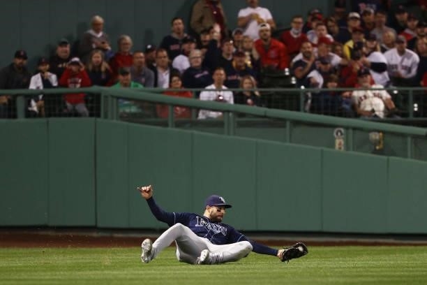 Kevin Kiermaier of the Tampa Bay Rays makes a sliding catch for the out on J.D. Martinez of the Boston Red Sox in the second inning during Game 4 of...