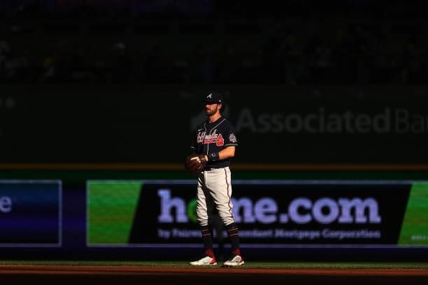 Dansby Swanson of the Atlanta Braves anticipates a pitch during game one of the National League Division Series against the Milwaukee Brewers at...