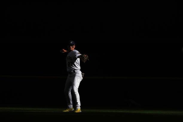 Willy Adames of the Milwaukee Brewers participates in warmups prior to game one of the National League Division Series against the Atlanta Braves at...