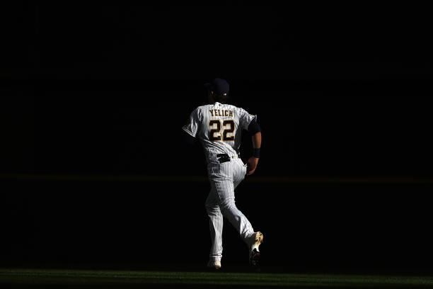 Christian Yelich of the Milwaukee Brewers participates in warmups prior to game one of the National League Division Series against the Atlanta Braves...