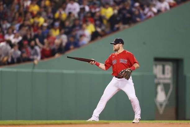 Josh Taylor of the Boston Red Sox play sword fights with a piece of the broken bat of Mike Zunino of the Tampa Bay Rays on a ground out in the third...