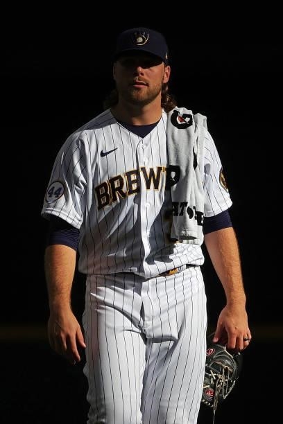 Corbin Burnes of the Milwaukee Brewers walks to the dugout prior to game one of the National League Division Series against the Atlanta Braves at...
