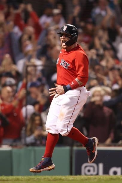 Christian Vazquez of the Boston Red Sox celebrates scoring on a three-run homerun by Rafael Devers in the third inning against the Tampa Bay Rays...