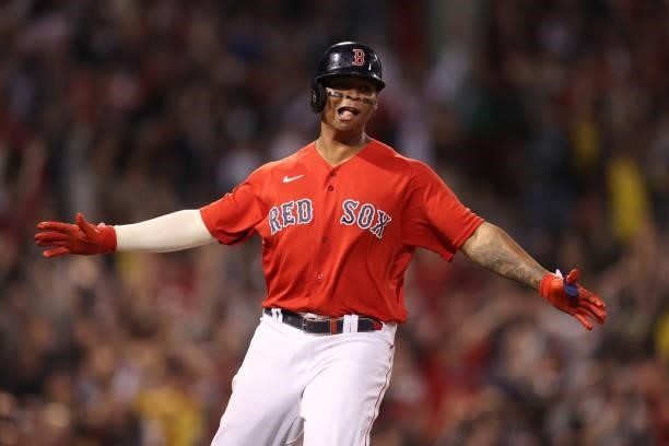 Rafael Devers of the Boston Red Sox celebrates his three-run homerun in the third inning against the Tampa Bay Rays during Game 4 of the American...
