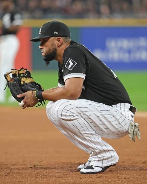 Jose Abreu of the Chicago White Sox waits for the inning to begin against the Houston Astros at Guaranteed Rate Field on October 10, 2021 in Chicago,...