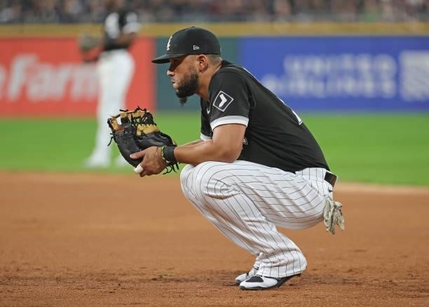 Jose Abreu of the Chicago White Sox waits for the inning to begin against the Houston Astros at Guaranteed Rate Field on October 10, 2021 in Chicago,...