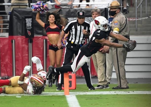 Rondale Moore of the Arizona Cardinals dives into the end zone for a touchdown against the San Francisco 49ers at State Farm Stadium on October 10,...